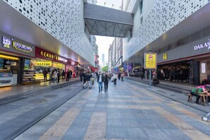 A pedestrian walkway with shops on either side, overhead canopies, and a tiled floor. - Shenzhen Haoyoulai Hotel (Dongmen Pedestrian Street Hubei Subway Station) (Shenzhen)