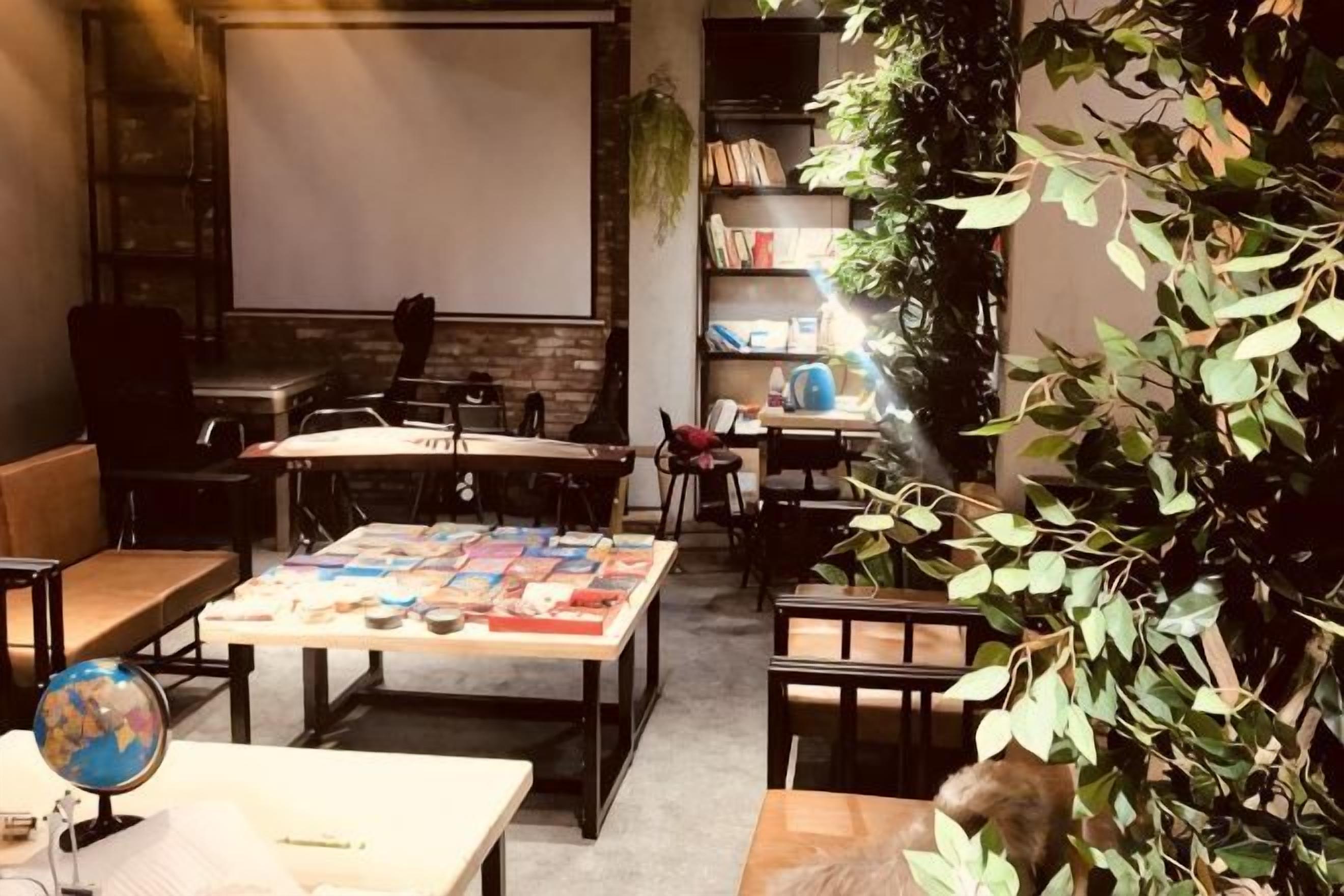A cozy room with a large table, chairs, a globe, and a bookshelf.