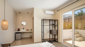 A modern bathroom with a sink, mirror, and towel rack. - ATMA BEACH ROOMS & SUITES (Rhodes)
