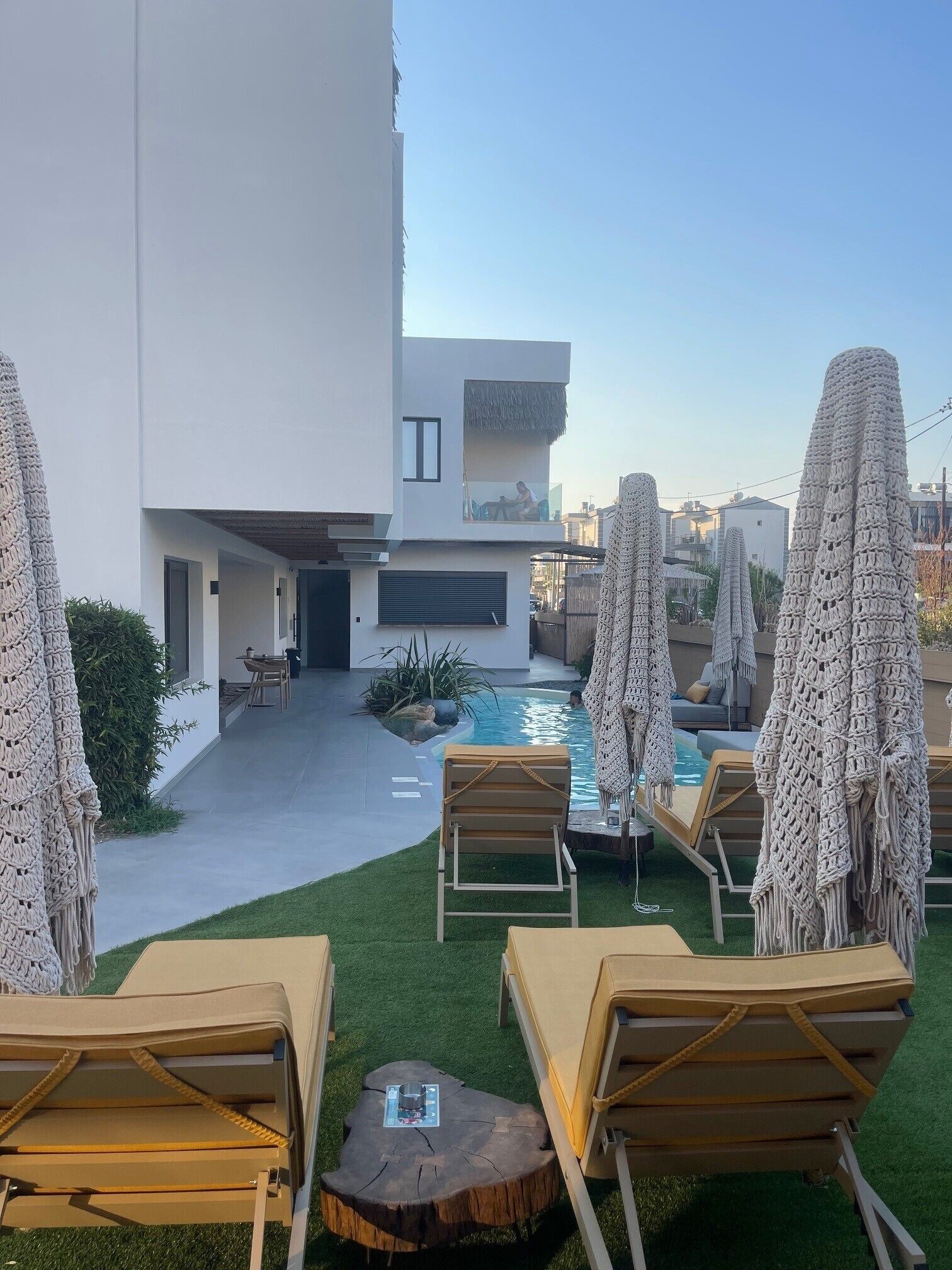 Seasonal outdoor pool, open 9:00 AM to 9:00 PM, pool umbrellas