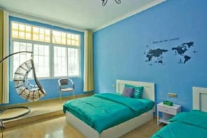 A bedroom with a bed, a hanging chair, a nightstand, and a wall map. - manmancoffee (Zixing)