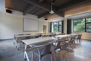 A modern conference room with tables and chairs, large windows, and a projector screen. - Fuzhou Xin'an Office, Shibuya Villa (Fuzhou)