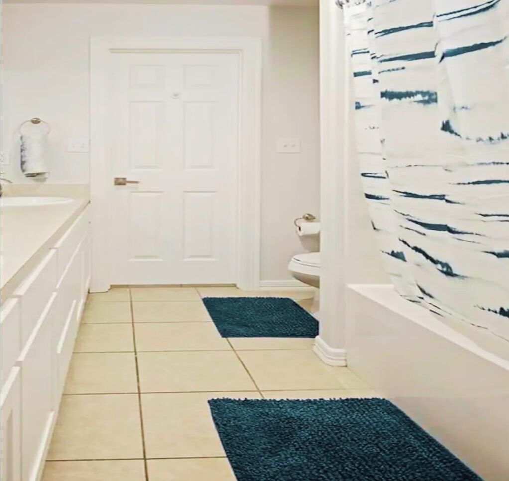 Bathtub, hair dryer, towels, soap