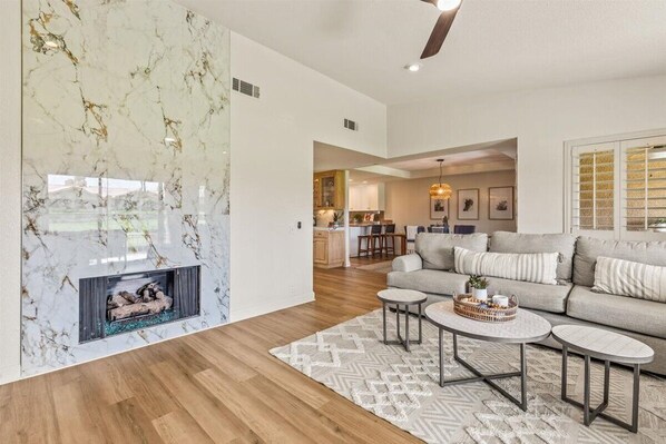 Smart TV, fireplace, books, offices