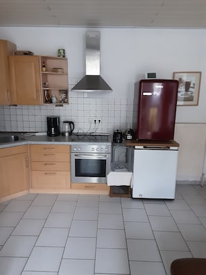 Fridge, microwave, stovetop, coffee/tea maker