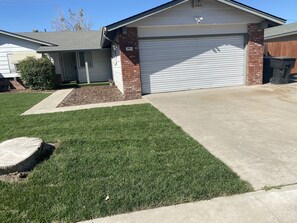 Enjoy a, secure home with a well-maintained yard and a brick facade.