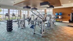 A gym with treadmills, weight machines, and free weights. - 24TH FLOOR WITH STUNNING ENDLESS VIEWS (Holly Hill)