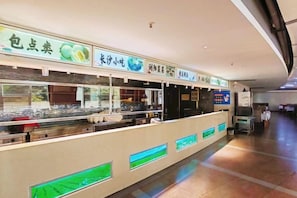 A food counter with various food items displayed and a digital menu. - International Academic Exchange Center (Yuntang Campus Hotel, CSUST) (Changsha)