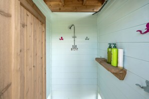 Combined shower/tub, hair dryer, towels, soap