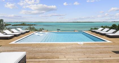 Luxury beachfront villa with dock and a private large heated pool. For 10 people