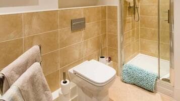 Bathtub, hair dryer, towels, soap
