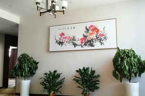 A framed artwork with floral design, potted plants, and a chandelier. - MingJue (Jurong)