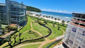 A coastal hotel with a view of the beach and ocean.