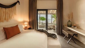 A hotel room with a bed, bedside tables, a desk, and a view of the beach. - Villa Blanca, Tulum – Beachfront • Chef Included (Tulum)