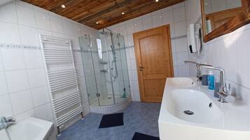 Bathtub, hair dryer, towels, soap