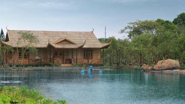 A traditional building with a curved roof by a calm body of water. - Sincerity Holiday Apartment Hostel (Haikou)