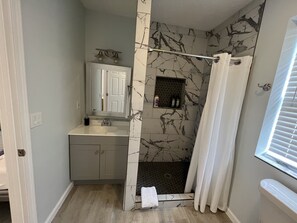 Combined shower/tub, hair dryer, towels, soap