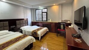 A hotel room with two beds, a desk with a chair, a television, and a window. - Holiday Weekend Hotel (Xiahe)