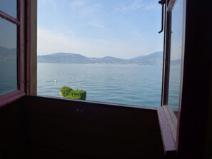 Enjoy breathtaking views of the lake and surrounding mountains from this room's window.