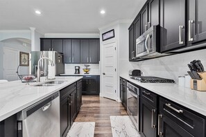 Fridge, microwave, oven, stovetop - Cozy 4 bedroom 3.5 bath home located in the heart of Little Elm.  (Little Elm)