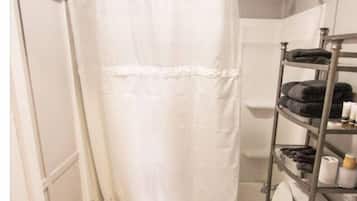 Combined shower/tub, hair dryer, towels, soap