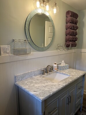 Shower, hair dryer, towels, soap