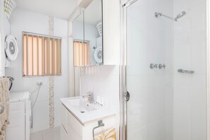 Shower, towels, soap, toilet paper