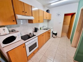 Standard Apartment | Private kitchen | Fridge, microwave, oven, stovetop