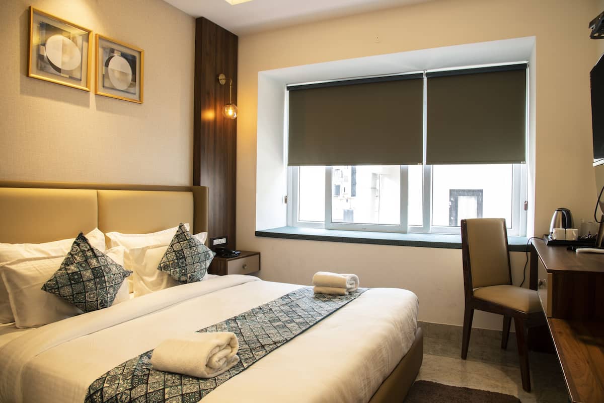 Premium bedding, memory-foam beds, minibar, desk