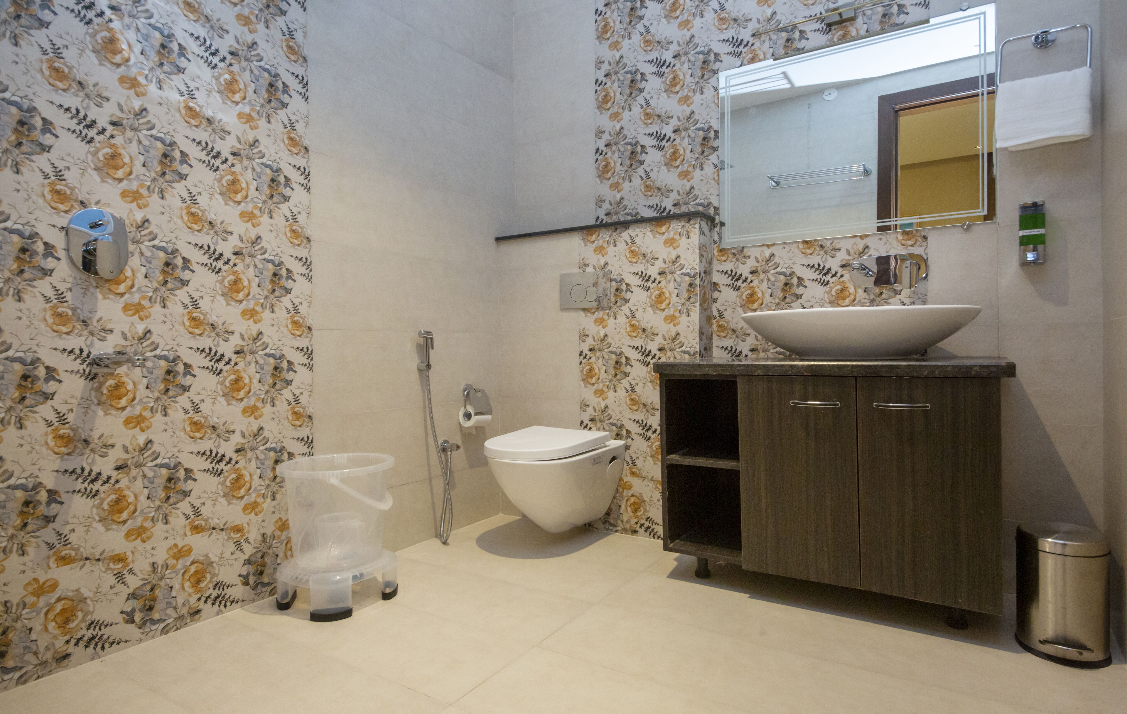 A bathroom with a toilet, sink, and shower.