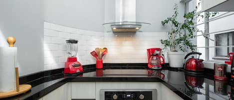 Apartment, 2 Bedrooms | Private kitchen | Coffee/tea maker, electric kettle, dining tables