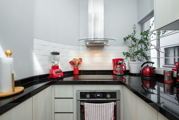 Apartment, 2 Bedrooms | Private kitchen | Coffee/tea maker, electric kettle, dining tables