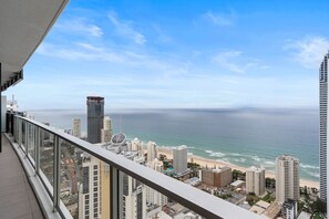 Enjoy unobstructed views of the coastline from this high-rise building's glass facade.