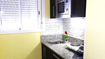 Fridge, microwave, coffee/tea maker, toaster