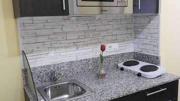 Fridge, microwave, coffee/tea maker, toaster