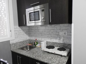Fridge, microwave, coffee/tea maker, toaster