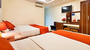 A hotel room with two beds, a desk, a TV, and a wardrobe. - HANZ Boutique Hotel Ben Thanh (Ho Chi Minh City)
