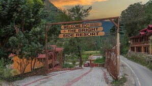 A wooden sign welcoming visitors to The Bright Side Resort. - The Bright Side Resort (Banjar)