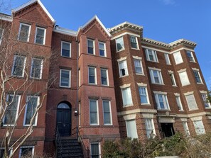 Classic townhouses with symmetrical facades and evenly spaced windows.