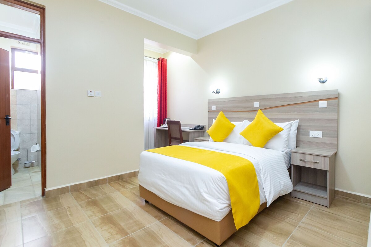 Premium bedding, memory foam beds, desk, laptop workspace