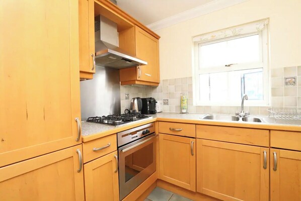 Fridge, microwave, toaster, dining tables