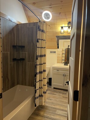 Bathtub, hair dryer, towels, soap