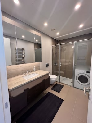 Designer toiletries, hair dryer, towels