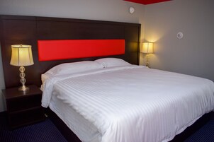 Habitación individual ejecutiva | Tabla de planchar con plancha, wifi gratis, ropa de cama