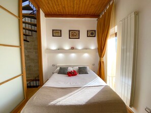 1 bedroom, desk, iron/ironing board, travel crib