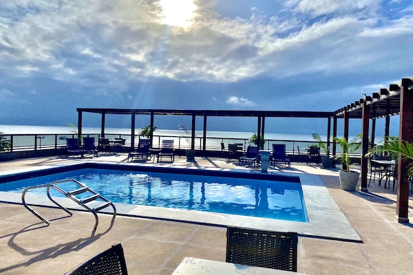 Outdoor pool, open 8:00 AM to 6:00 PM, pool umbrellas, sun loungers