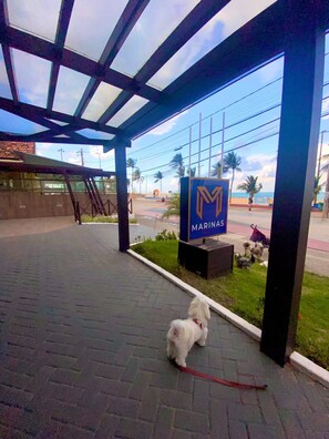 A covered outdoor area with a sign for 'Marinas'.
