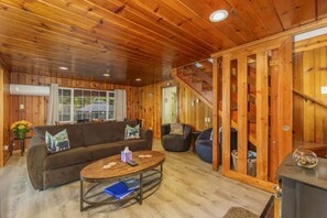 Relax in a warm, inviting space with a comfortable seating area and a view of the outdoors.