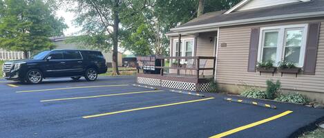A parking lot with marked spaces and a building labeled "MAGNUM 22 LODGE" in the background.