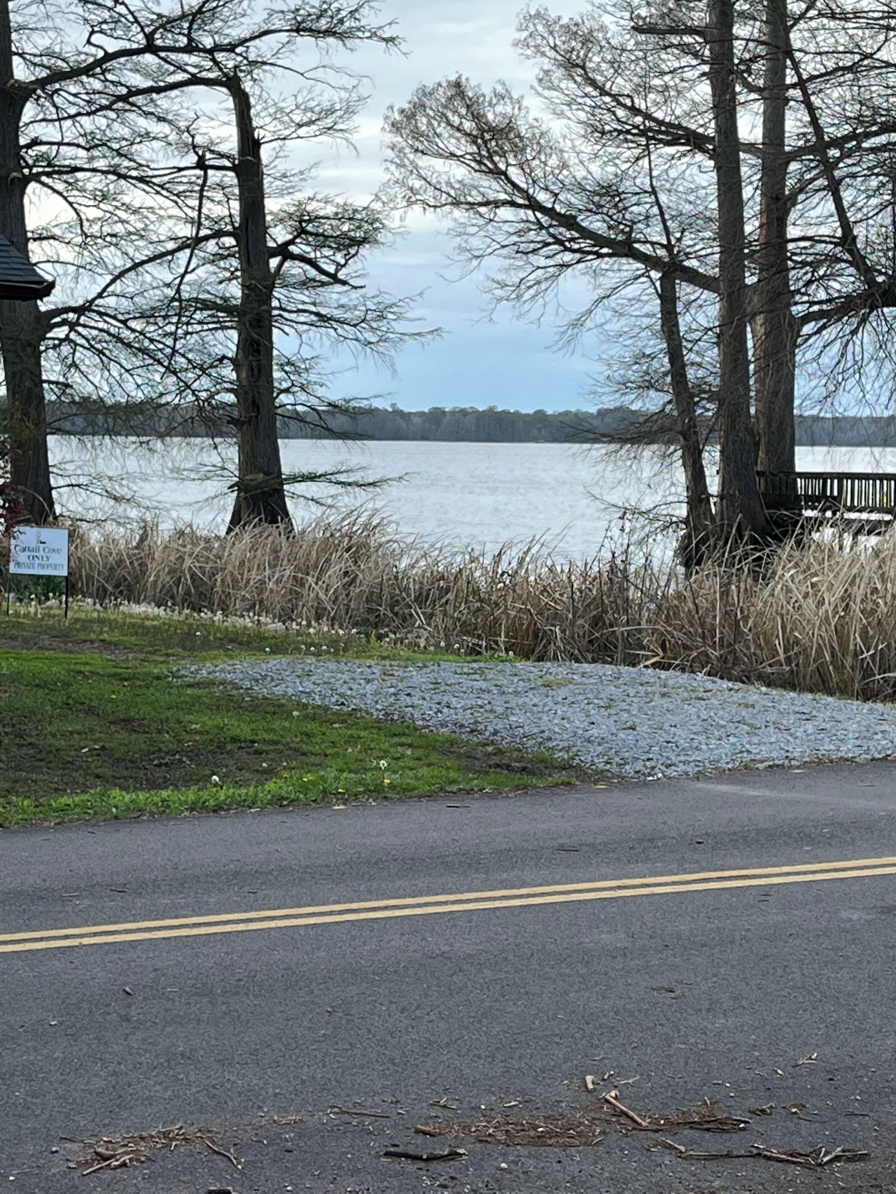 A paved road with a sign indicating private property.
